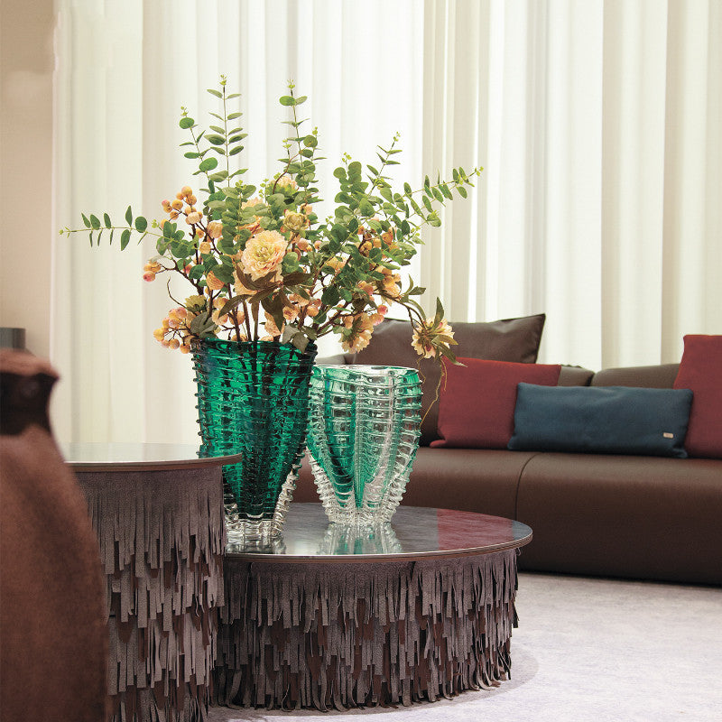 Luxury living room decor with green glass vase on coffee table