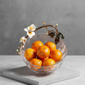 Side view of bowl with oranges highlighting capacity