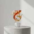 Enamel and gold-tone Koi fish sculpture on clear crystal sphere base