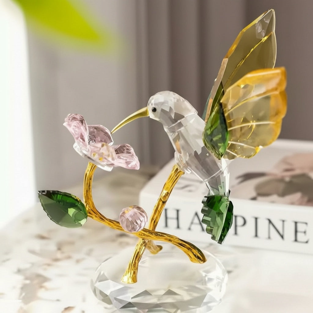 Crystal hummingbird figurine with amber wings and pink flower