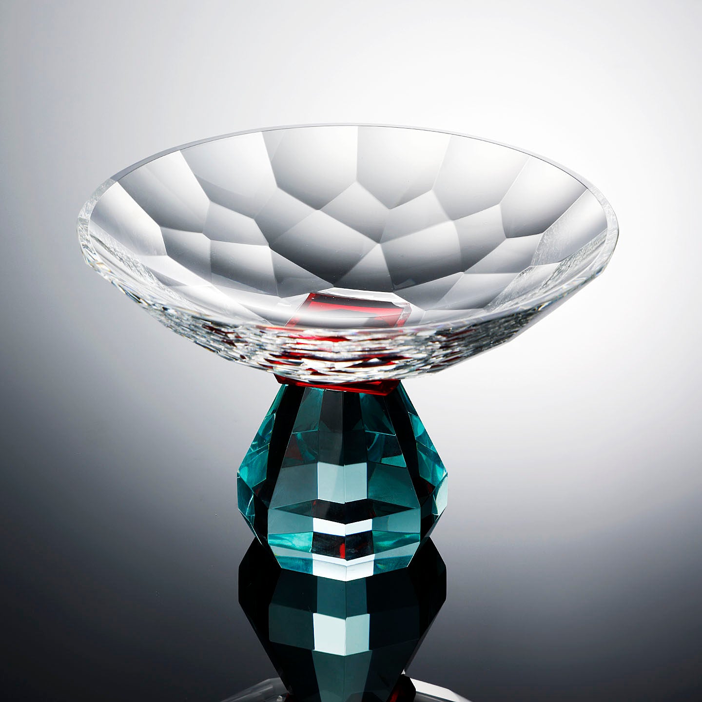 Faceted crystal pedestal centerpiece bowl with teal geometric base front view