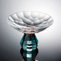 Front view of luxury crystal pedestal centerpiece bowl with faceted glass and teal base