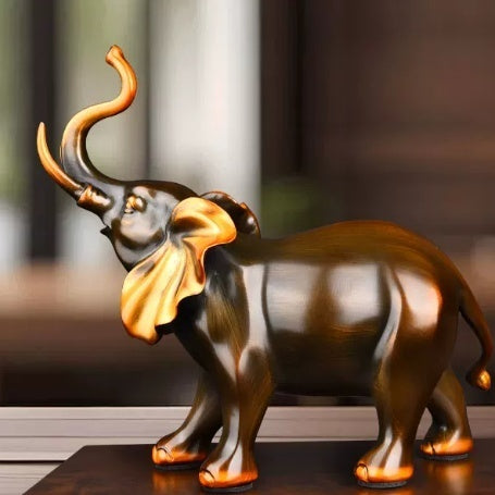 Side view of fine copper elephant sculpture with raised trunk