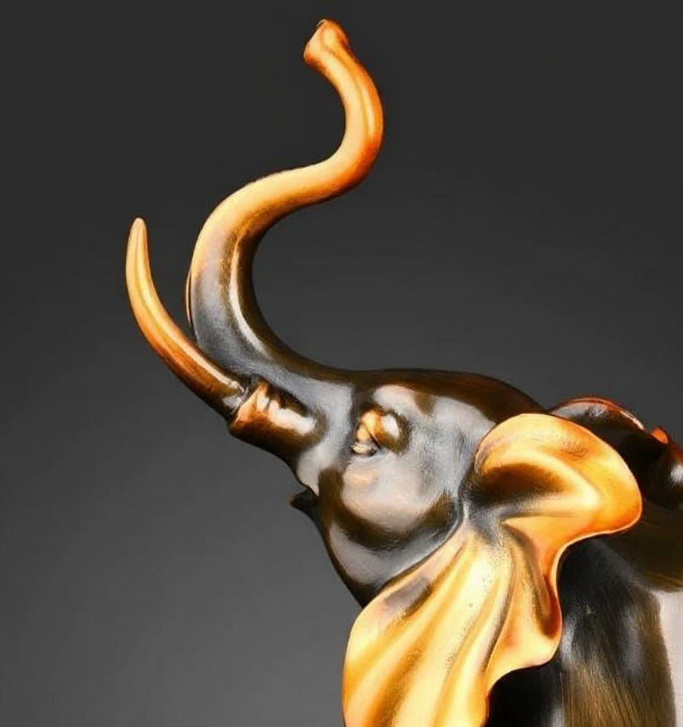 Close up detail of copper elephant head and gold ears