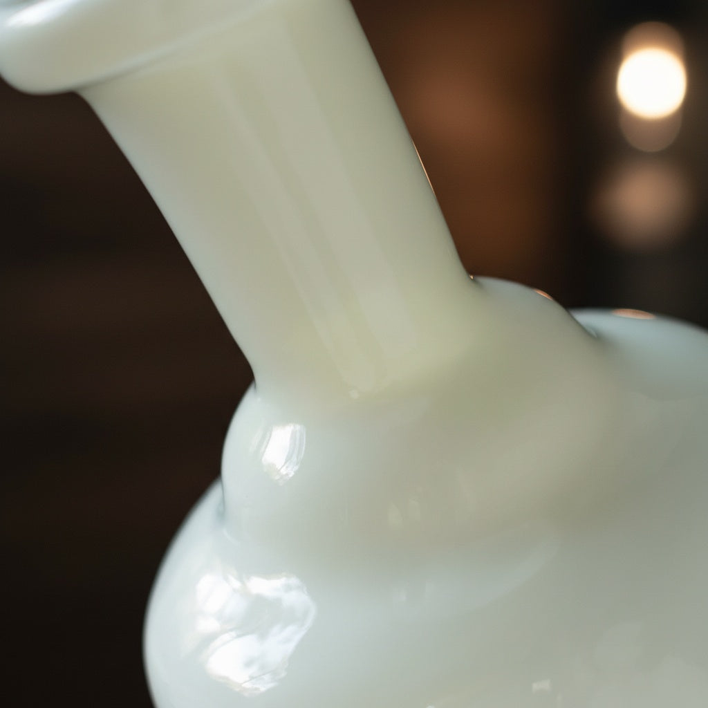 Close up of frosted glass pedestal vase neck