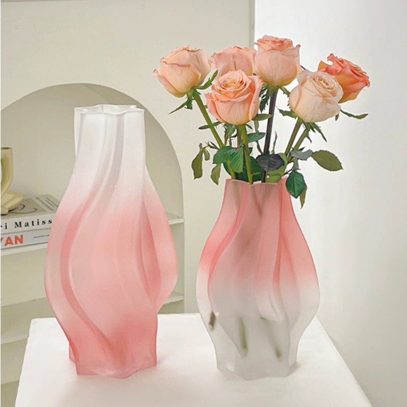 Pink frosted glass vase with roses