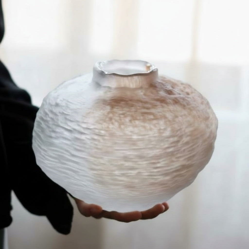 Close up of organic rim detail on frosted glass vase