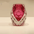 Front view of faceted fuchsia and clear crystal vase