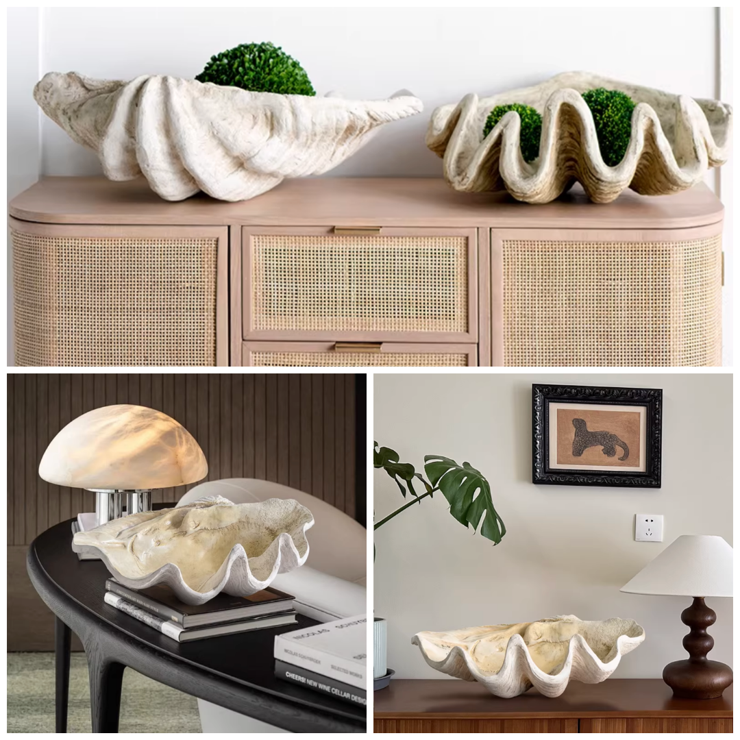 Oversized resin clam shell bowl displayed on a cabinet with smaller shell decor pieces