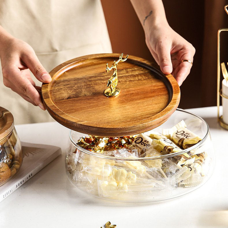 Side view of glass bowl filled with wrapped candies showing transparency