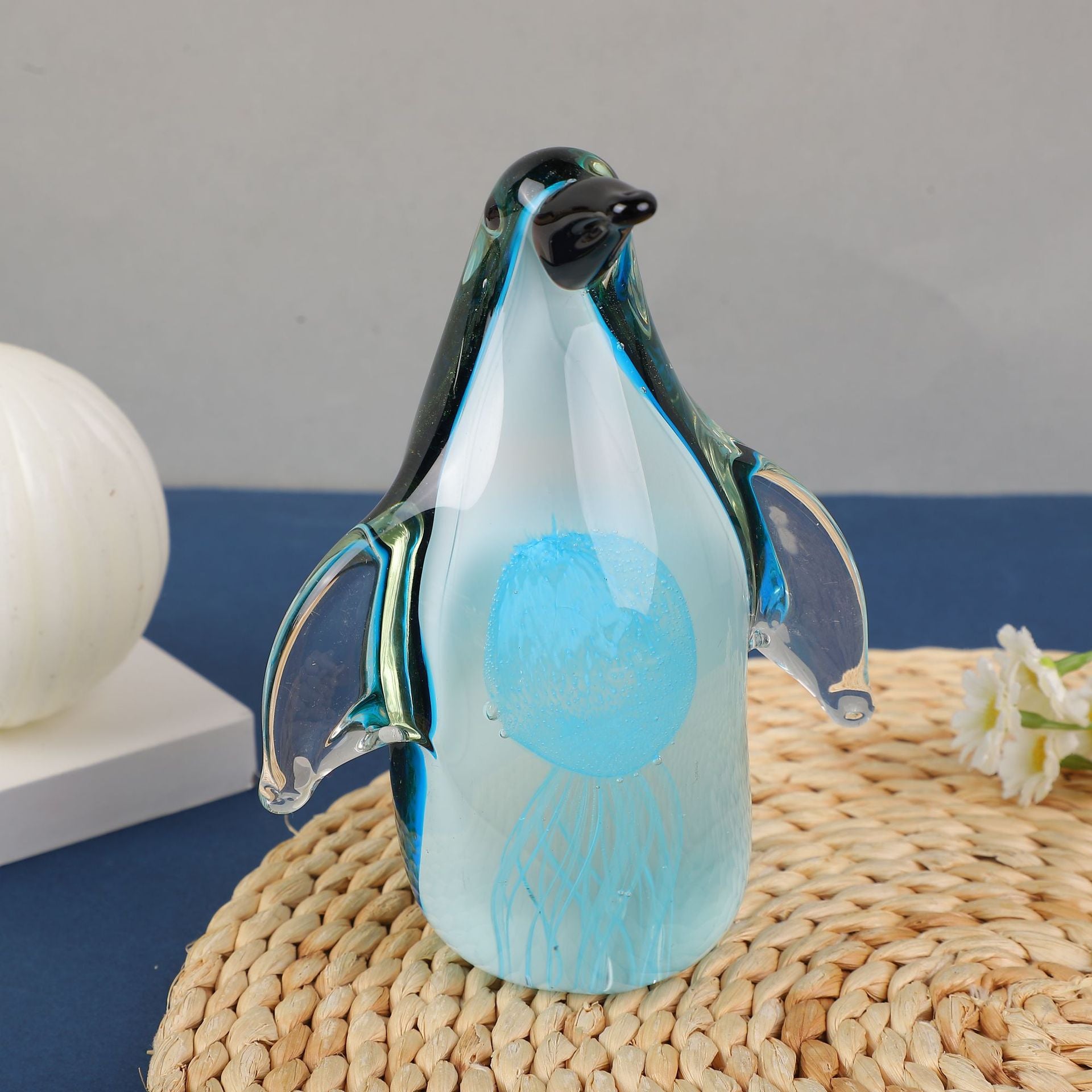 Front view of glass penguin with internal jellyfish