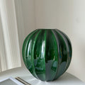 Glazed ceramic fluted spherical vase in emerald green
