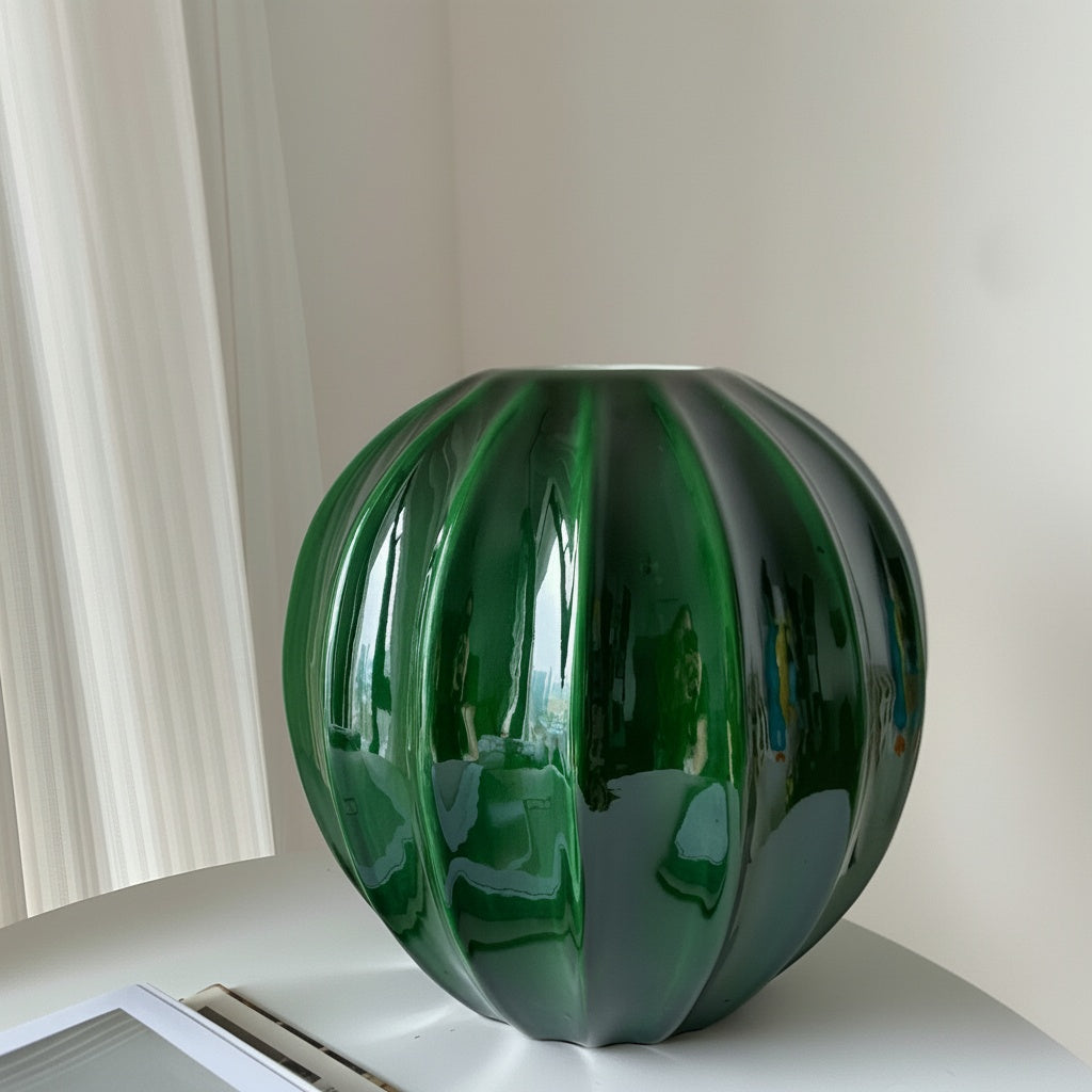 Glazed ceramic fluted spherical vase in emerald green