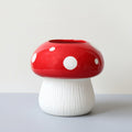 Glazed ceramic mushroom vase with red canopy and white spots