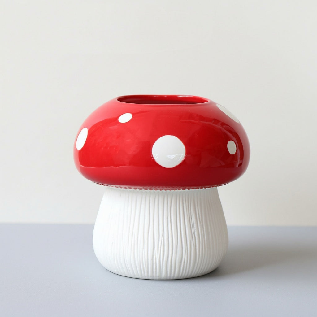 Glazed ceramic mushroom vase with red canopy and white spots