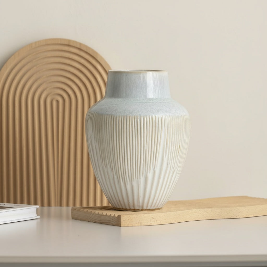 Glazed Ceramic Ribbed Vase displayed on a wooden board