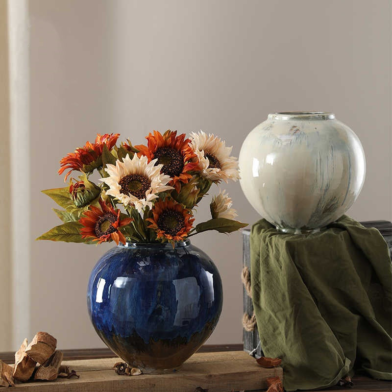 Main group shot of blue and white vases with flowers