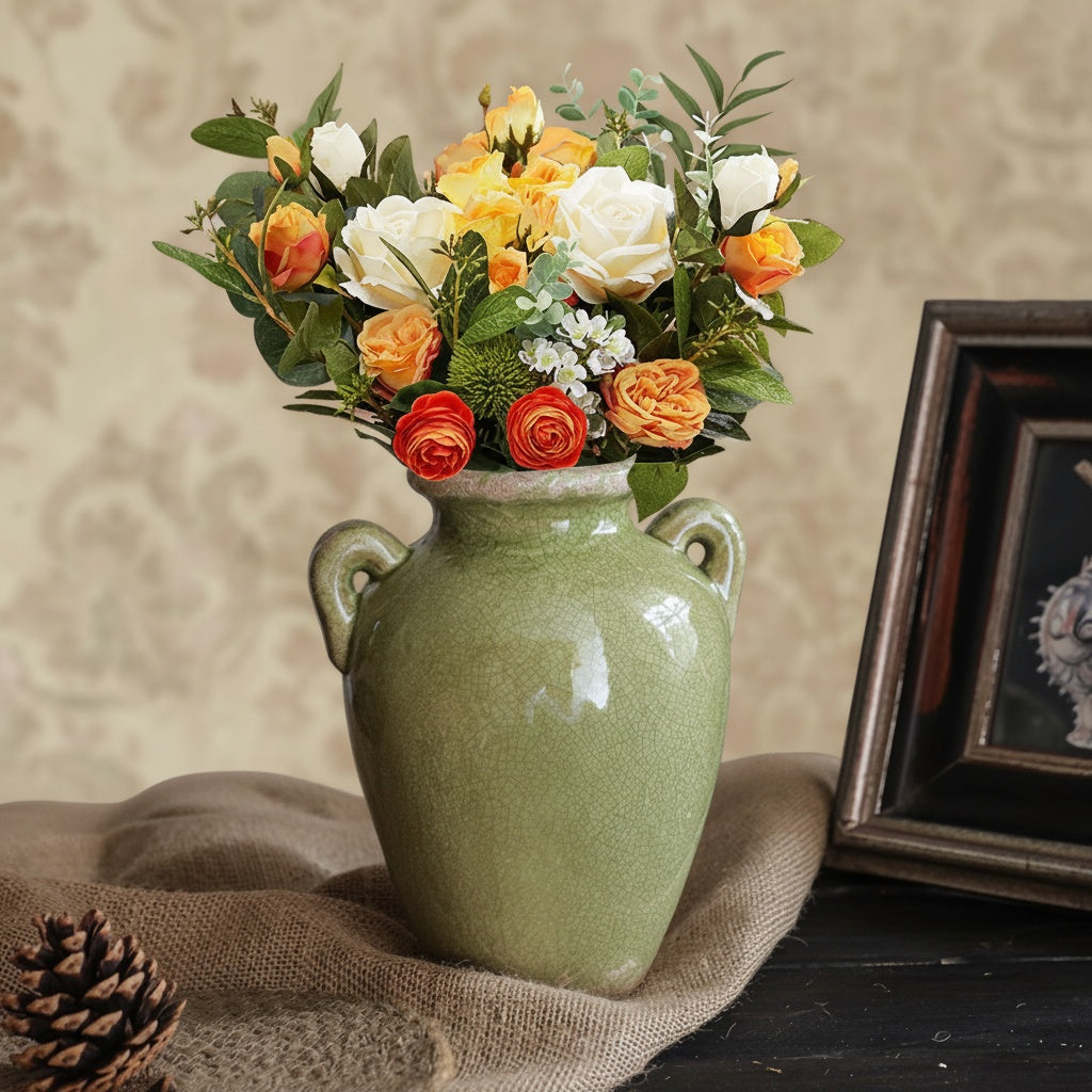 Glazed Green Ceramic Handled Vase styled with vibrant floral arrangement