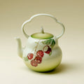 Glazed porcelain teapot with green gradient and hand-painted lychee motif
