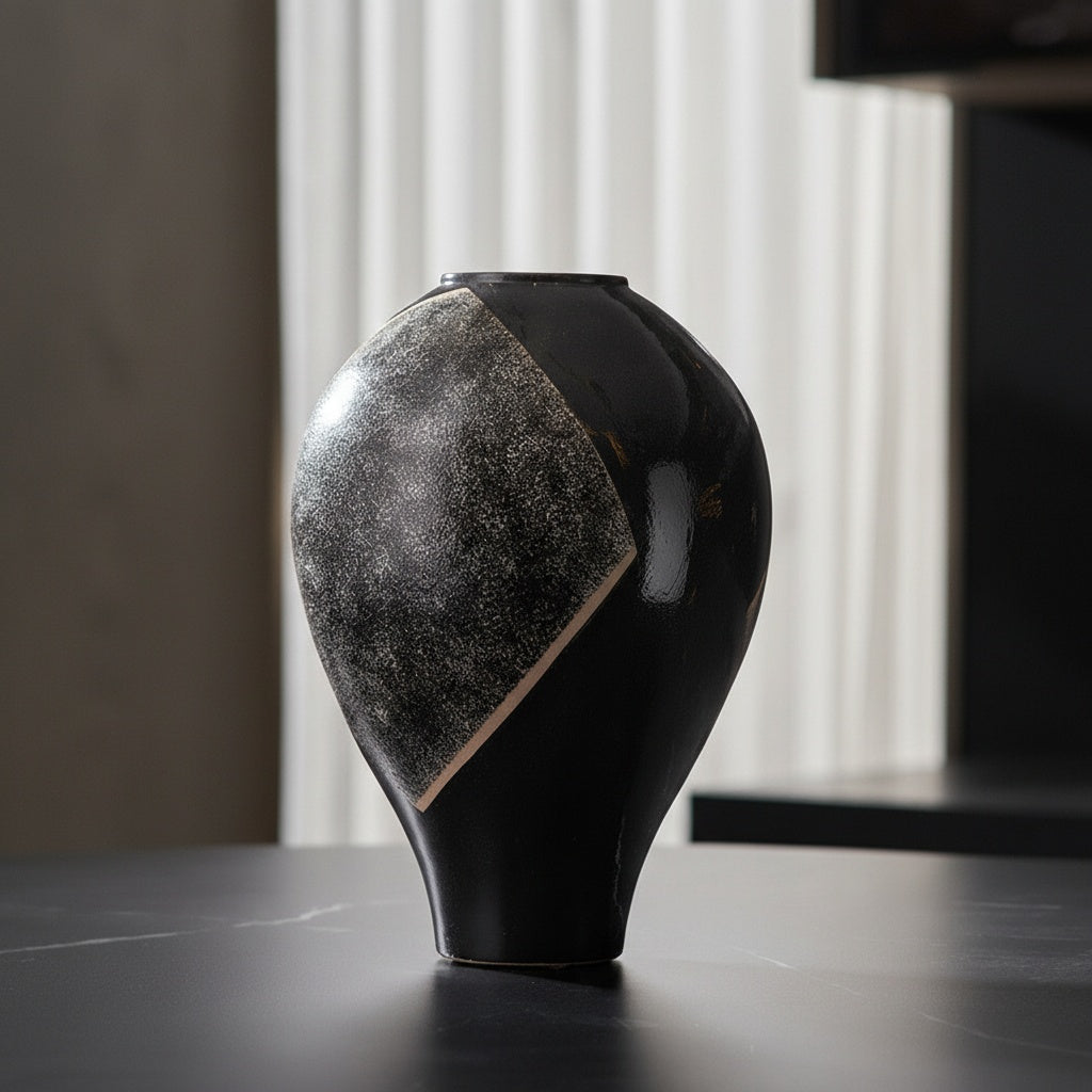 Gloss black ceramic vase with textured geometric accent front view