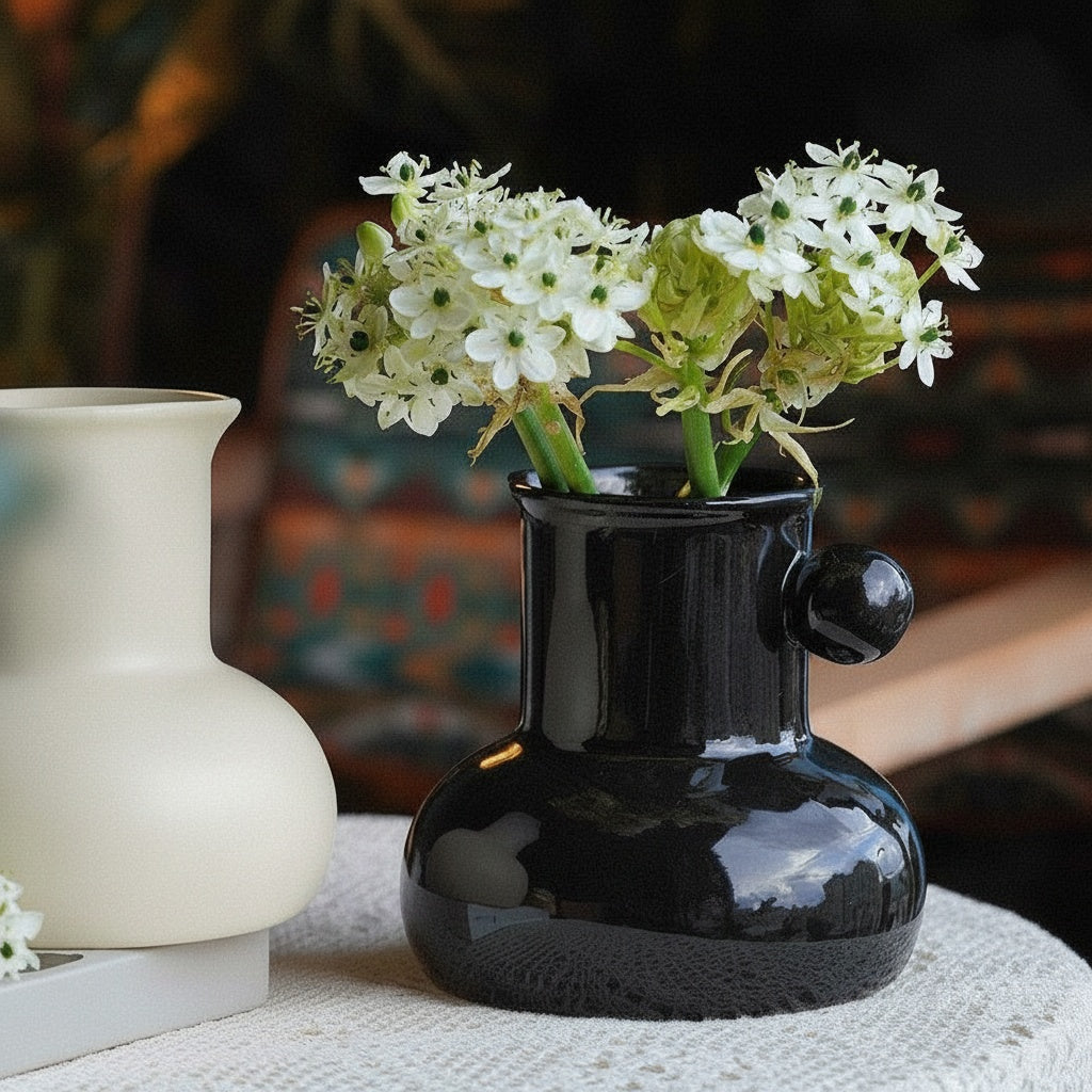 Glossy Black Ceramic Spouted Vase with Flowers