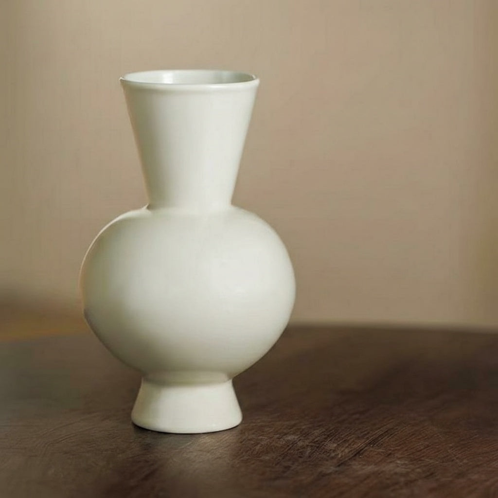 White glossy ceramic vase with flared neck close up
