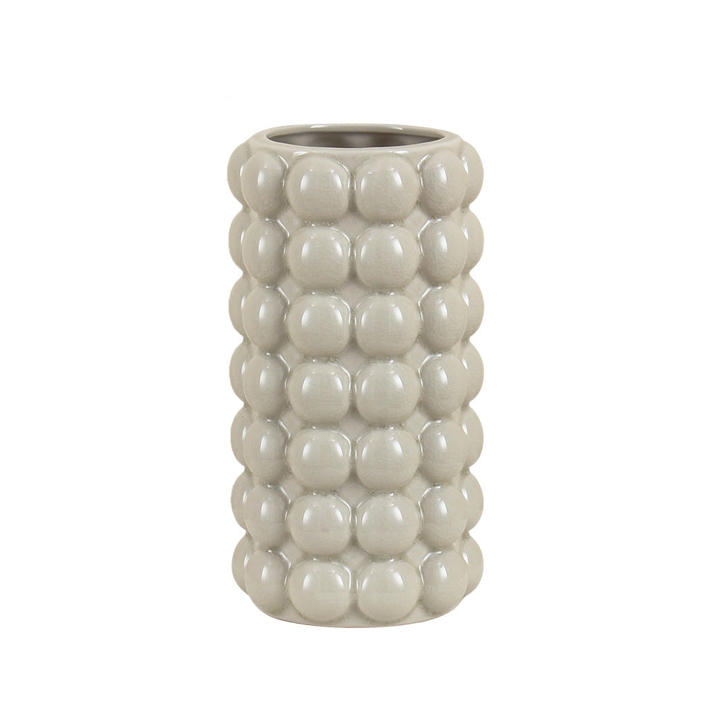 Large cylindrical grey ceramic vase with spherical texture