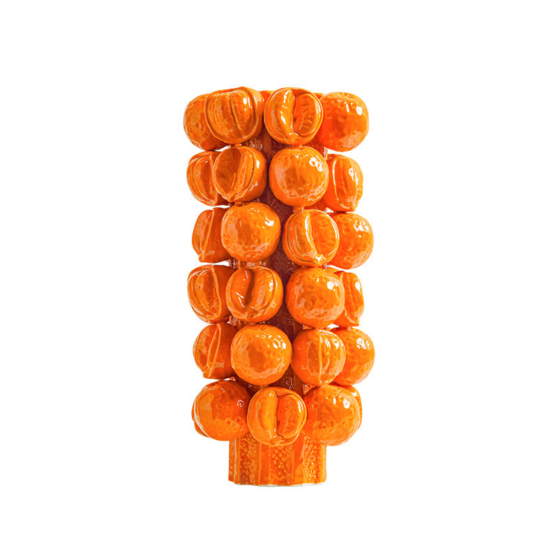 Front view of tall glossy orange ceramic vase with bubble texture