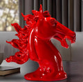 Side profile of glossy red horse head sculpture showing dynamic mane details