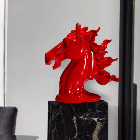 Front angle view of red stallion statue on marble pedestal