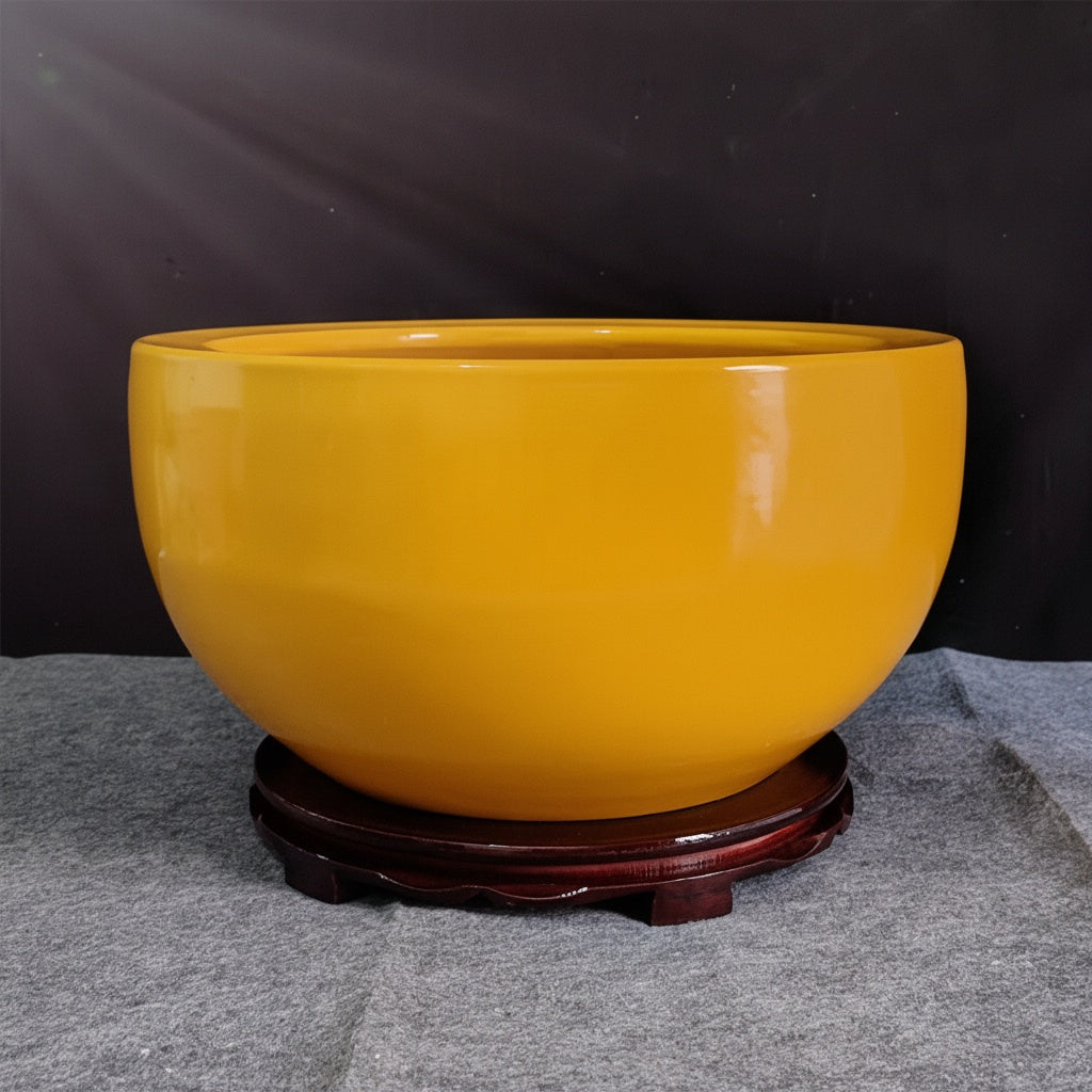 Front view of glossy yellow ceramic decorative bowl