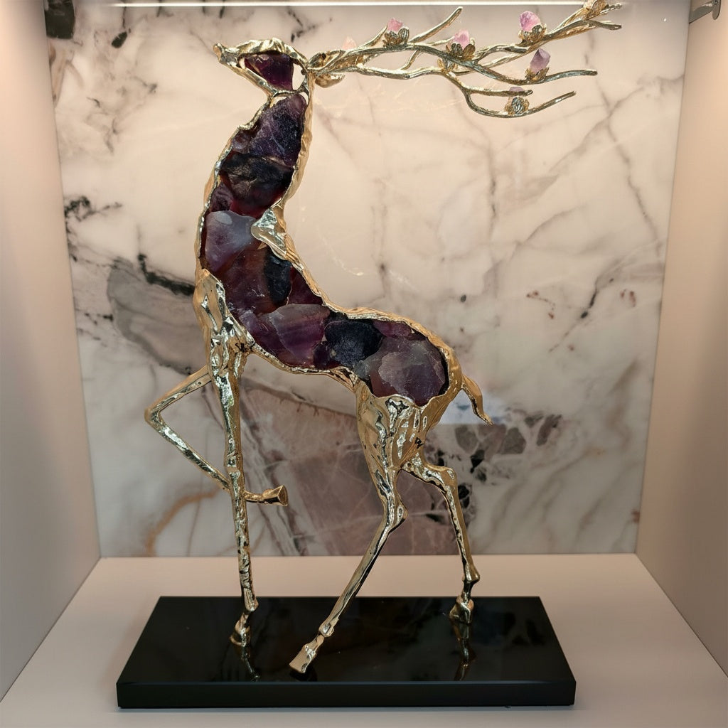 Gold finish deer sculpture with amethyst crystal body and black base