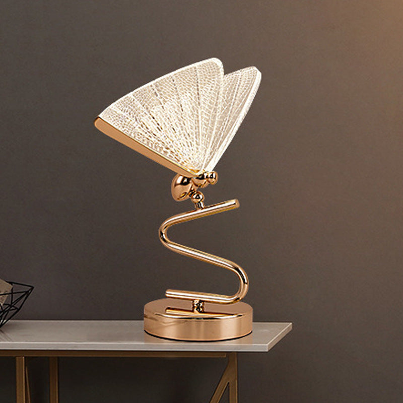 Gold-tone metal butterfly table lamp with acrylic wings main view