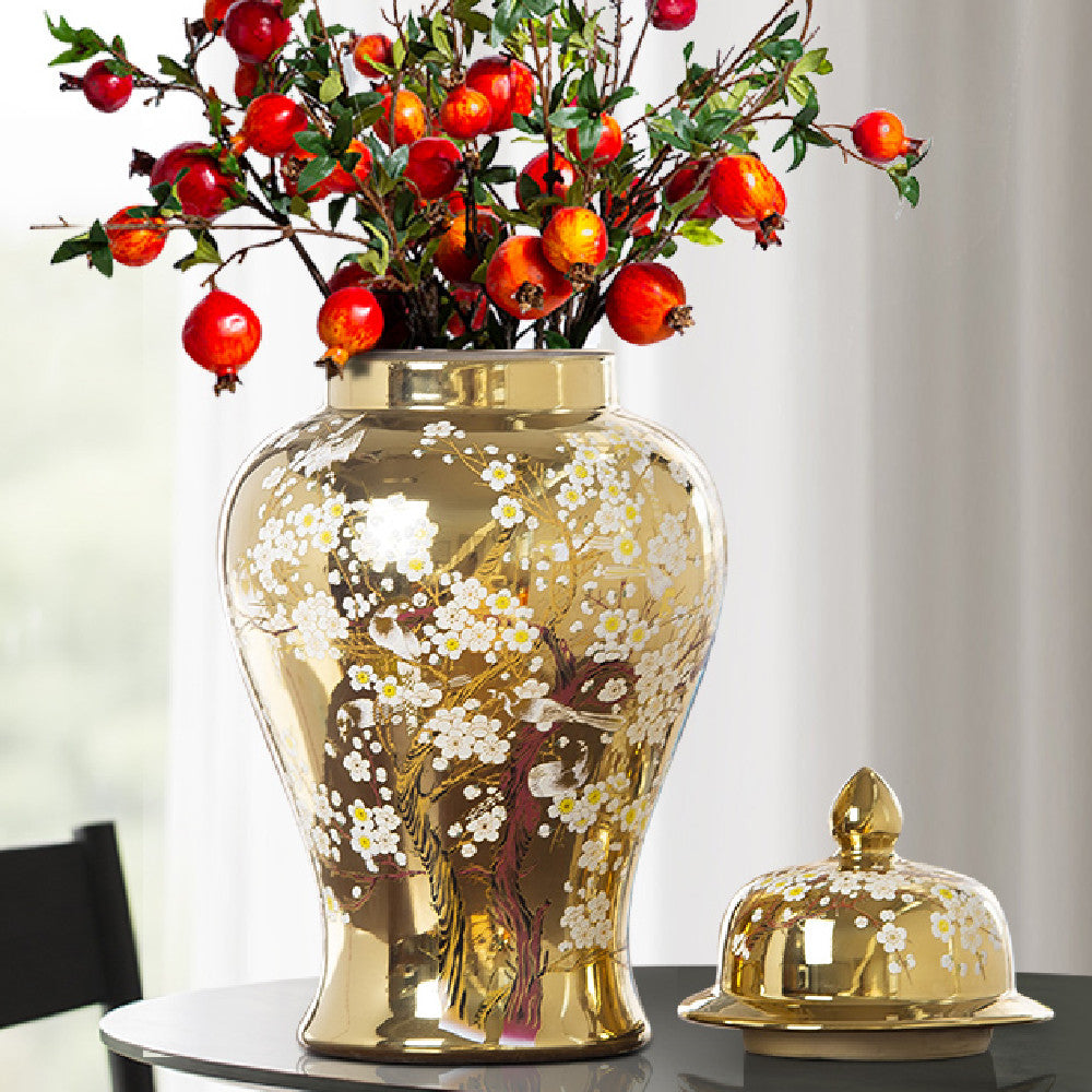 Front view of gold temple jar with pomegranate branches