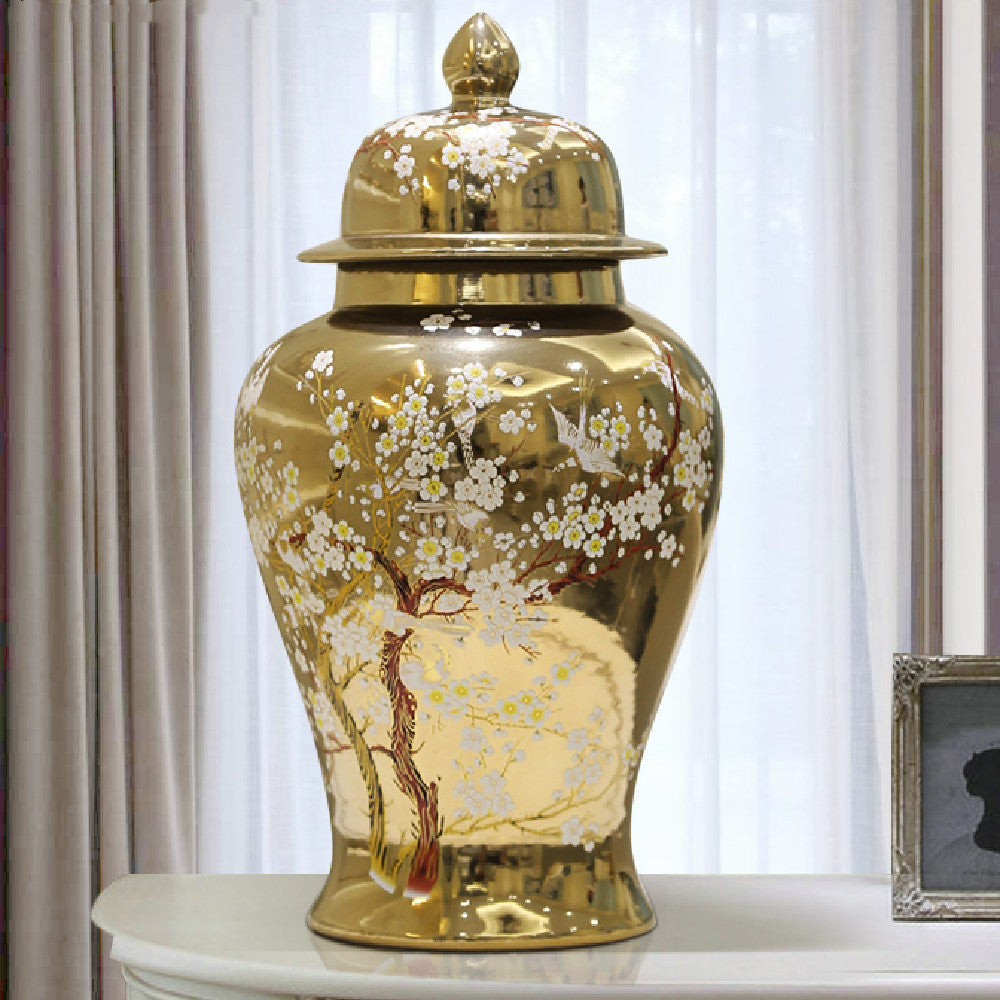 Full view of gold floral temple jar on console