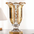 Front view of gold and clear crystal fluted vase with floral detail
