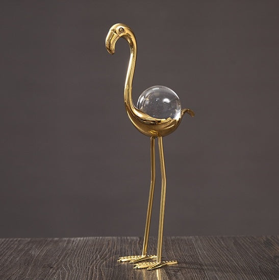 Detailed side view of the curved neck flamingo figurine