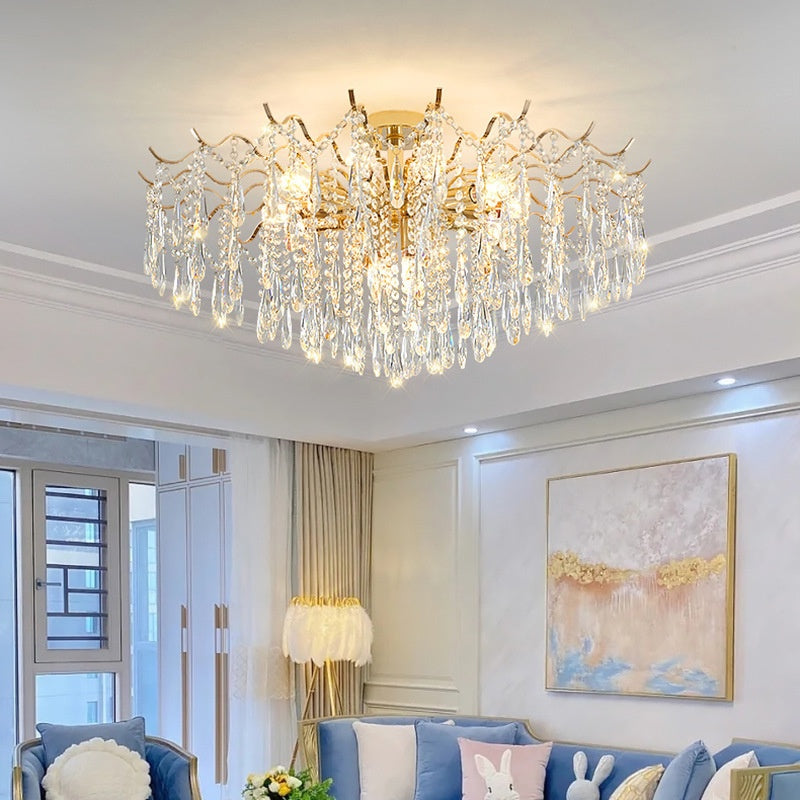 Low angle view of illuminated gold and crystal chandelier