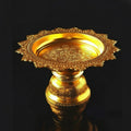 Gold-tone embossed pedestal tray with scalloped edges