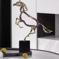 Gold-finish metal and amethyst crystal rearing horse sculpture on black base