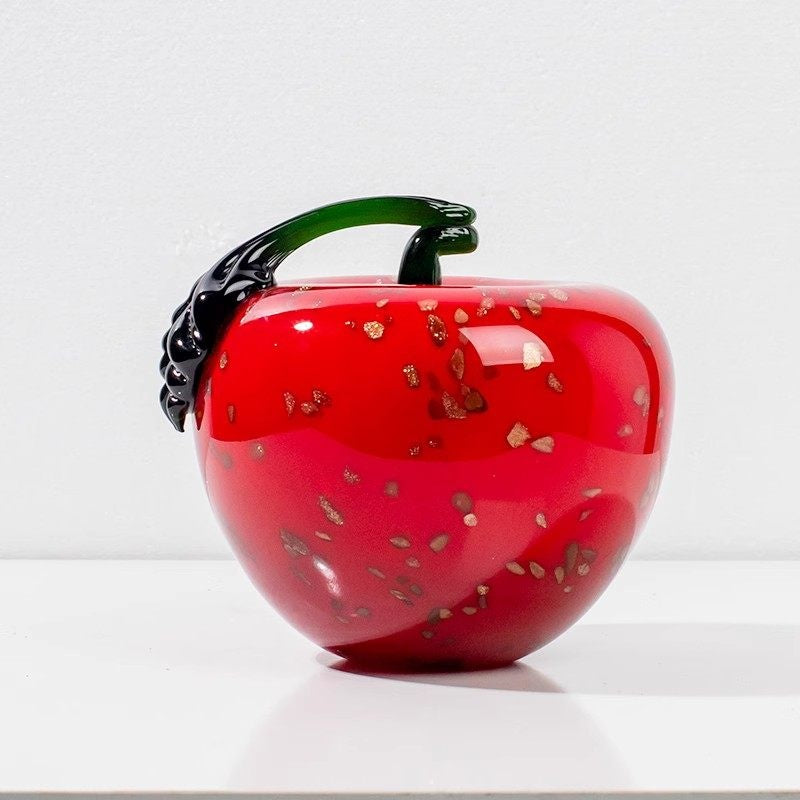 Red art glass apple with black stem side view