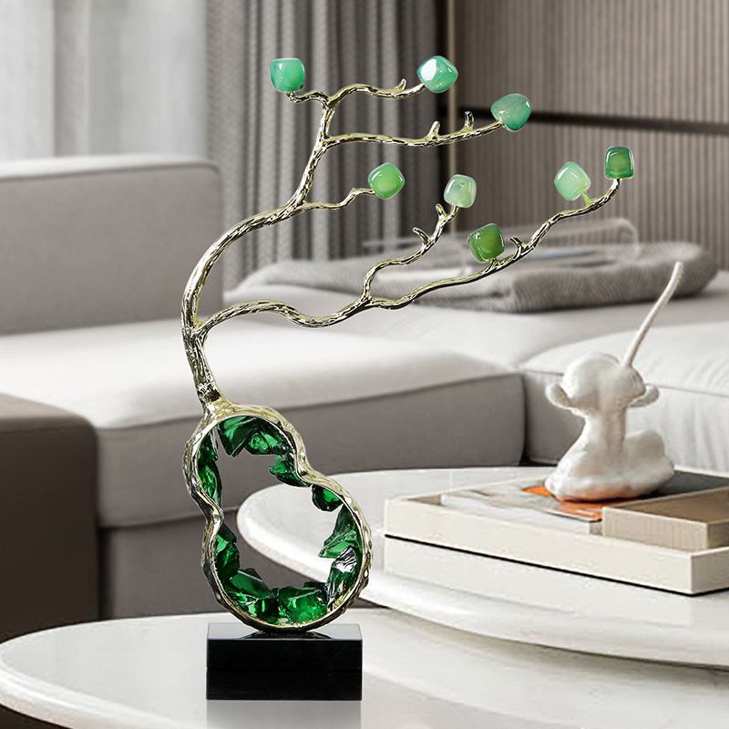 Crystal tree sculpture styled on marble table with accessories