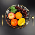 Top view of gold honeycomb glass fruit plate filled with fruit