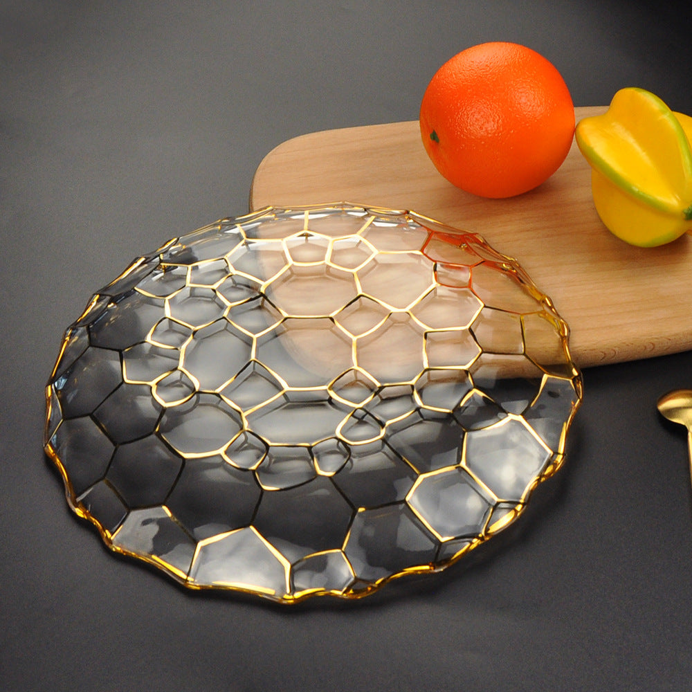 Inverted view of the glass plate showing gold geometric pattern details