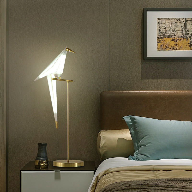 Luxury gold bird lamp in modern bedroom