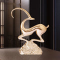Gold resin abstract antelope sculpture side profile on textured base