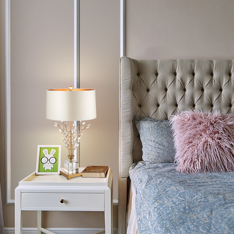 Detail of gold branch lamp on side table