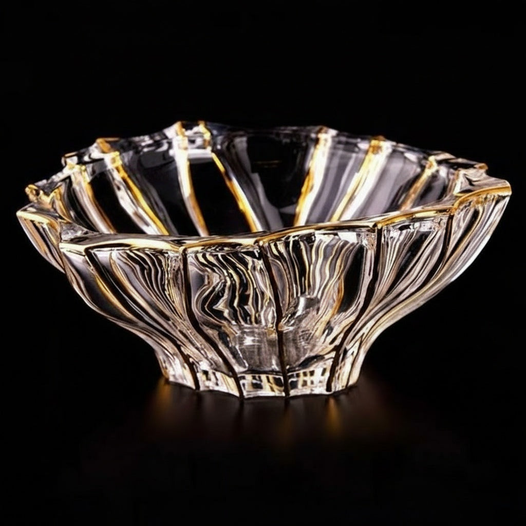 Front view of gold rimmed crystal scalloped centerpiece bowl on black background