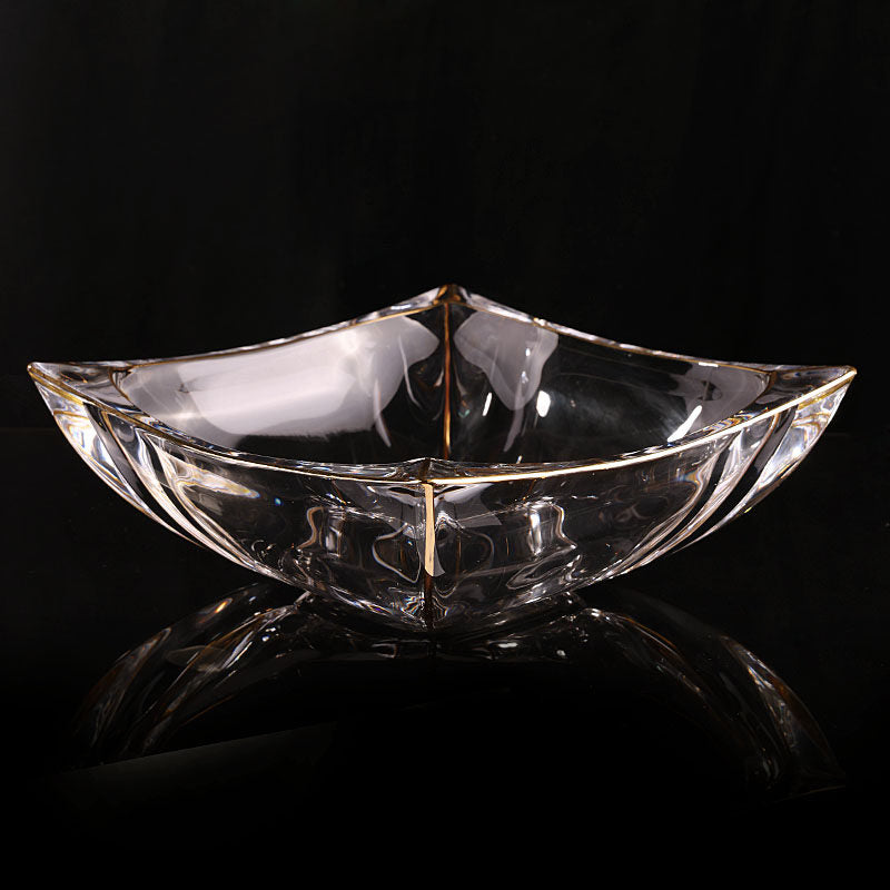 Angled view of crystal square bowl with gold rim
