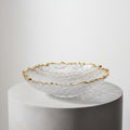 Gold-rimmed textured crystal serving bowl with irregular edge